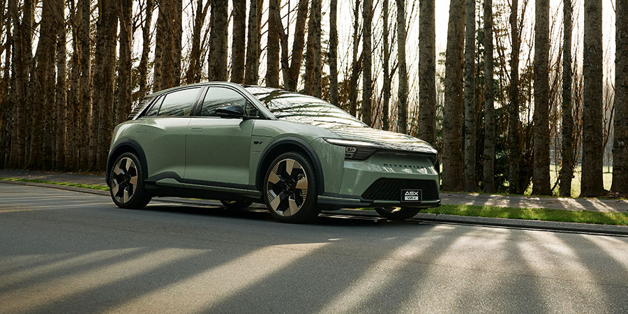 Side profile of a green electric SUV